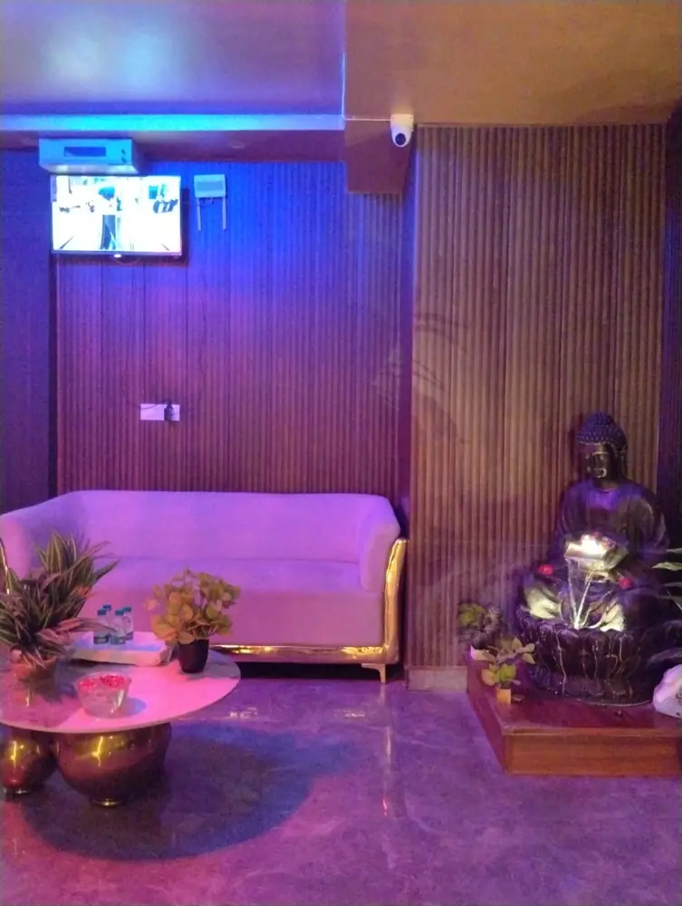 Lounge seating with Buddha fountain at Lavya Thai Spa